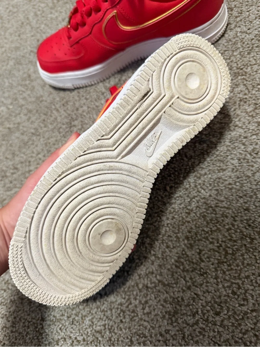 Nike Red Low-Top Sneakers with Gold Swoosh